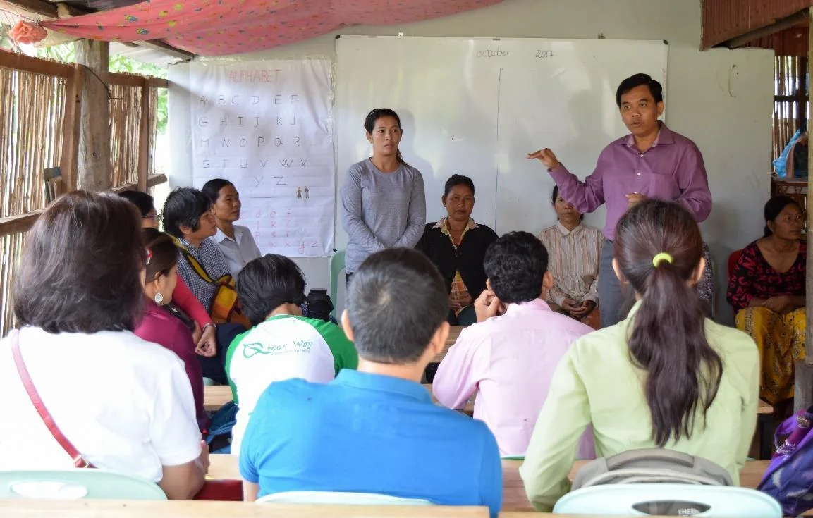 Women and men take part in a cooperative learning session