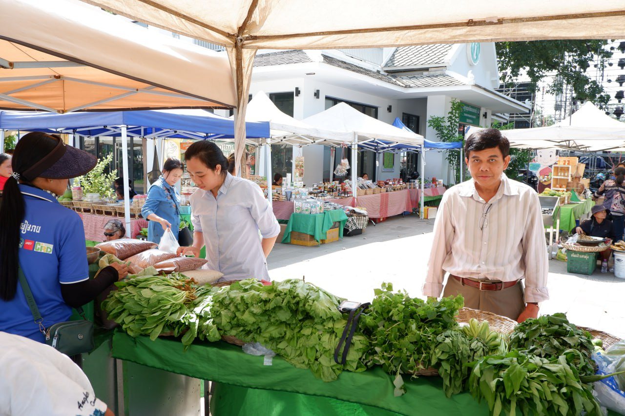 Producers and shoppers at a vegetable market in Siem Reap