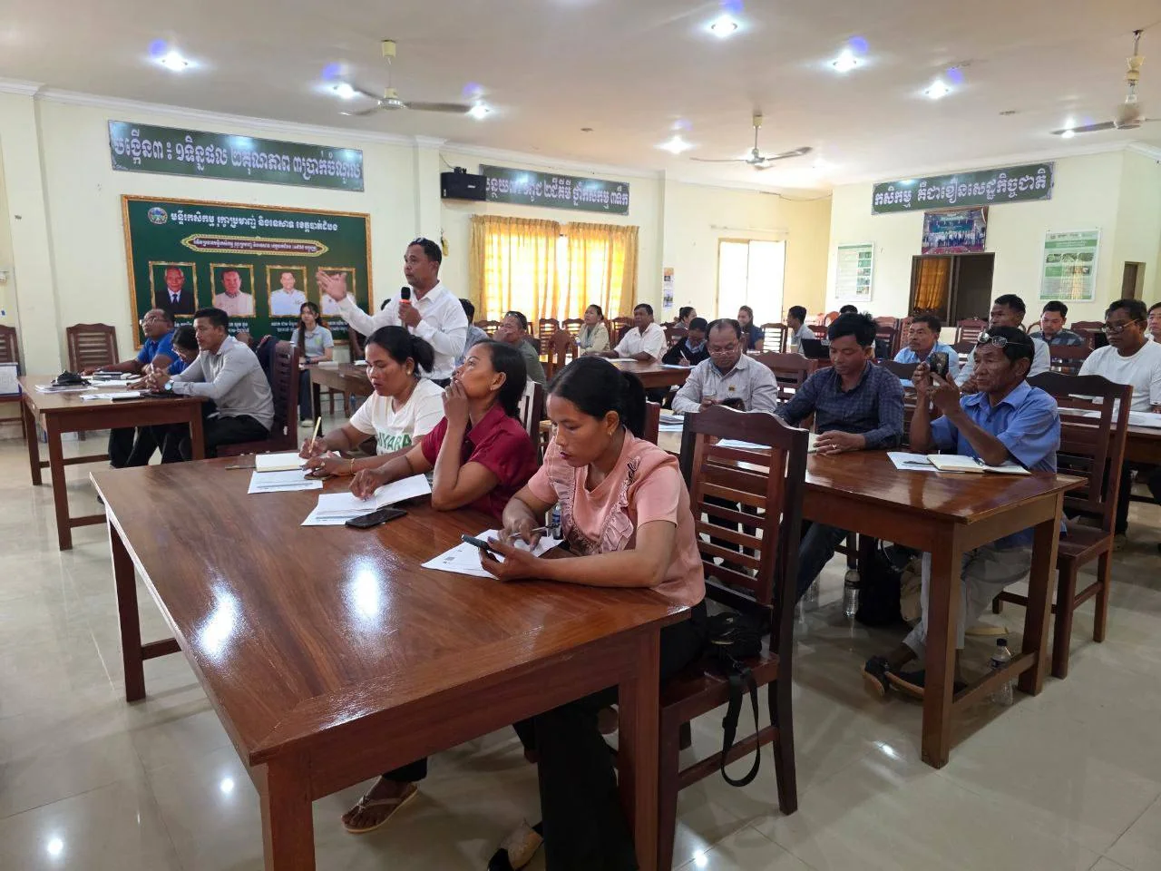 A participant addresses the group during CIRD's SRP training in Battambang